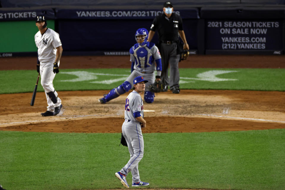 New York Mets pitcher Drew Smith watches a grand slam hit by New York Yankees' Gary Sanchez during the eighth inning of the second baseball game of a doubleheader, Sunday, Aug. 30, 2020, in New York. (AP Photo/Adam Hunger)