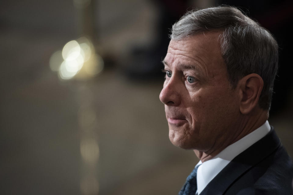 Supreme Court Chief Justice of the U.S. John G. Roberts Jr. waits for the arrival of the casket of former President George H.W. Bush carried into the Capitol on Capitol Hill in Washington, Monday, Dec. 3, 2018. (Jabin Botsford/The Washington Post via AP, Pool)