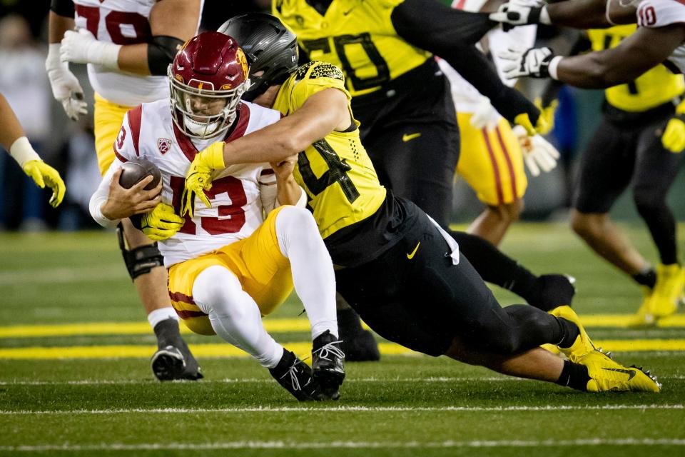 Oregon outside linebacker Teitum Tuioti sacks USC quarterback Caleb Williams as the No. 6 Oregon Ducks host the USC Trojans Saturday, Nov. 11, 2023, at Autzen Stadium in Eugene, Ore.