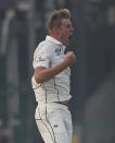New Zealand's Kyle Jamieson reacts after bowling India's Shubman Gill out during the day three of their first test cricket match with India in Kanpur, India, Saturday, Nov. 27, 2021. (AP Photo/Altaf Qadri)