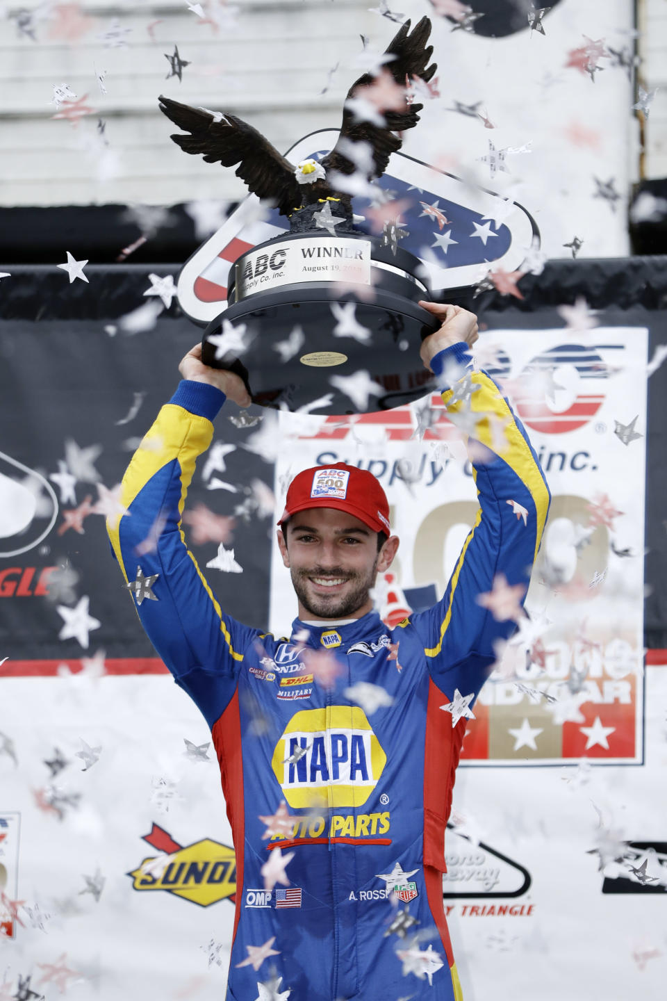 Alexander Rossi poses in Victory Lane after winning the IndyCar auto race at Pocono Raceway, Sunday, Aug. 19, 2018, in Long Pond, Pa. (AP Photo/Matt Slocum)