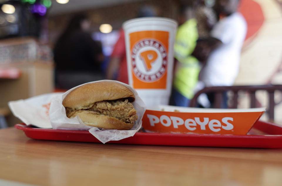 FILE - A chicken sandwich is displayed at a Popeyes fast food restaurant in Kyle, Texas, on Aug. 22, 2019. A new book, “Secrets of a Tastemaker: Al Copeland, The Cookbook," released last month, helped mark the 50th anniversary of Popeyes Famous Fried Chicken. (AP Photo/Eric Gay, File)