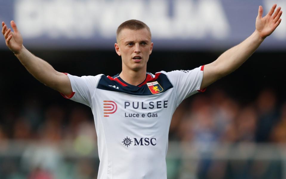 Albert Gudmundsson of Genoa raises his arms aloft during a Serie A match with Hellas Verona