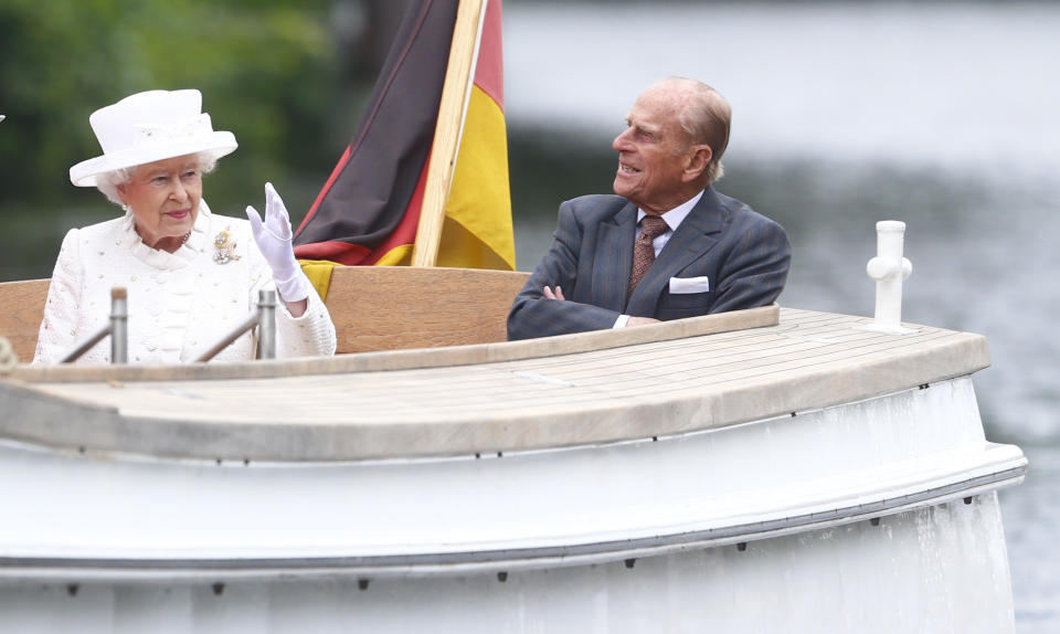 FILE - In this Wednesday June 24, 2015 file photo, Britain's Queen Elizabeth II and Prince Philip travel by boat on the Spree river in Berlin, Germany. Buckingham Palace officials say Prince Philip, the husband of Queen Elizabeth II, has died, it was announced on Friday, April 9, 2021. He was 99. Philip spent a month in hospital earlier this year before being released on March 16 to return to Windsor Castle. Philip, also known as the Duke of Edinburgh, married Elizabeth in 1947 and was the longest-serving consort in British history. (Hannibal Hanschke/Pool Photo via AP, File)