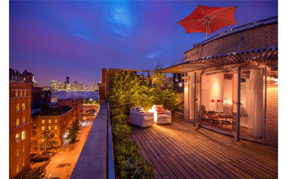 A nighttime view of the al fresco hangout. Courtesy of Evan Joseph/Douglas Elliman