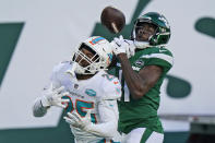 New York Jets' Denzel Mims, right, cannot hold onto the ball in the end zone while Miami Dolphins' Xavien Howard defends during the second half of an NFL football game, Sunday, Nov. 29, 2020, in East Rutherford, N.J. (AP Photo/Corey Sipkin)