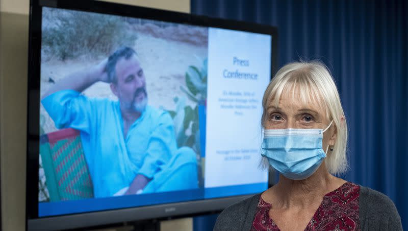 Els Woodke speaks about the 2016 kidnapping of her husband Jeff Woodke, photo on video monitor, by a jihadist terrorist group in West Africa, during a news conference in Washington, Wednesday, Nov. 17, 2021.