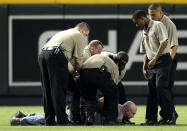 Security guards subdue a fan who ran onto the field during the Major League Baseball game between the Atlanta Braves and the Arizona Diamondbacks at Chase Field on June 10, 2010 in Phoenix, Arizona. (Photo by Christian Petersen/Getty Images)