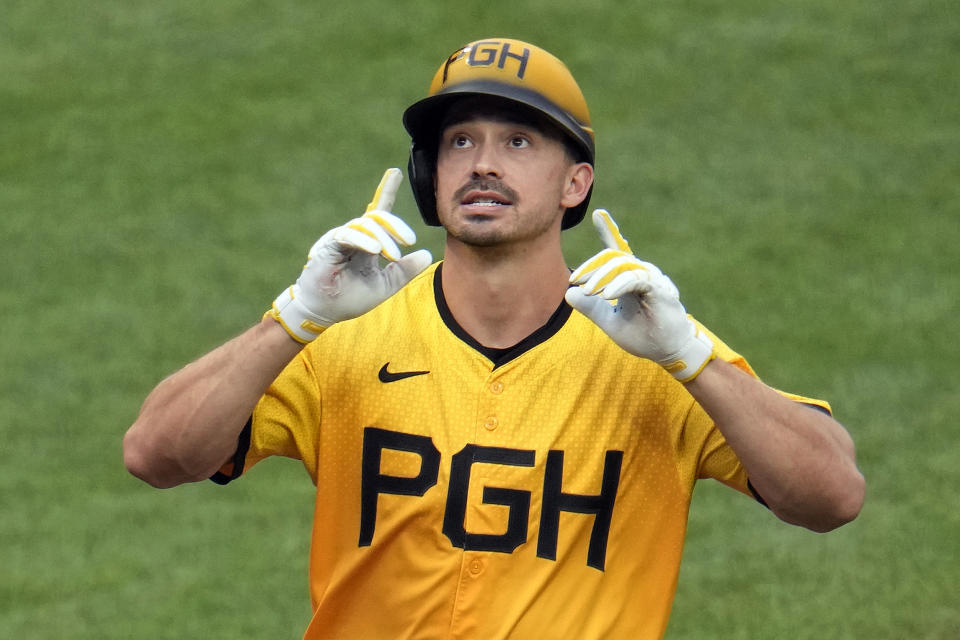 Pittsburgh Pirates' Bryan Reynolds celebrates as he crosses home plate after hitting a two-run home run off New York Mets starting pitcher Luis Severino during the fifth inning of a baseball game in Pittsburgh, Friday, July 5, 2024. (AP Photo/Gene J. Puskar)