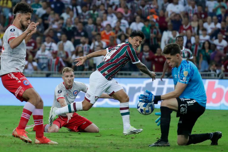 Goalkeeper Miguel Acosta of Argentina's Argentinos Juniors blocks an attack of German Cano of Brazil's Fluminense during a Copa Libertadores round of 16 second leg soccer match at the Maracana stadium in Rio de Janeiro, Brazil, Tuesday, Aug. 8, 2023. (AP Photo/Bruna Prado)