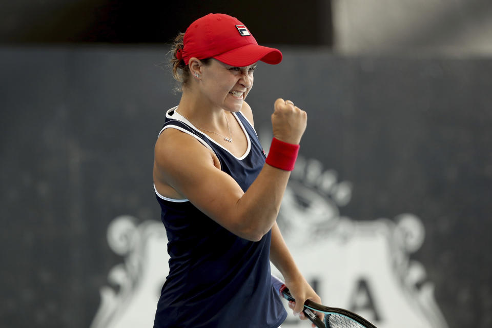 Australian Ashleigh Barty celebrates her win over Ukrainian Dayana Yastremska during their Adelaide International tennis match in Adelaide, Saturday, Jan. 18, 2020. (AP Photo/James Elsby)