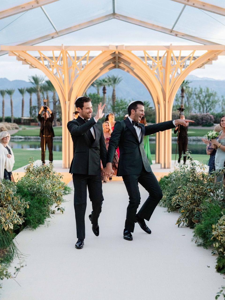 a couple of men walking down the aisle