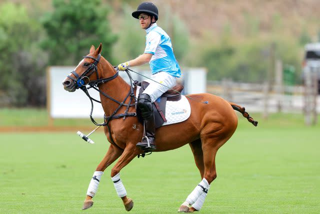 <p>Chris Jackson/Getty</p> Prince Harry competes in the 2022 Sentebale ISPS Handa Polo Cup.
