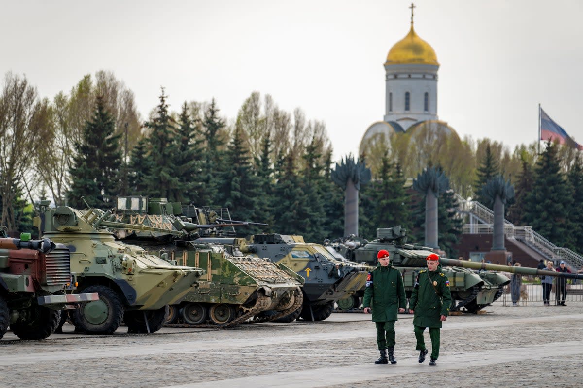 People visit an exhibition of tanks, APCs and guns of Ukrainian armed forces captured during the fighting displayed near the World War II museum on Poklonnaya Hill in Moscow. (AP)
