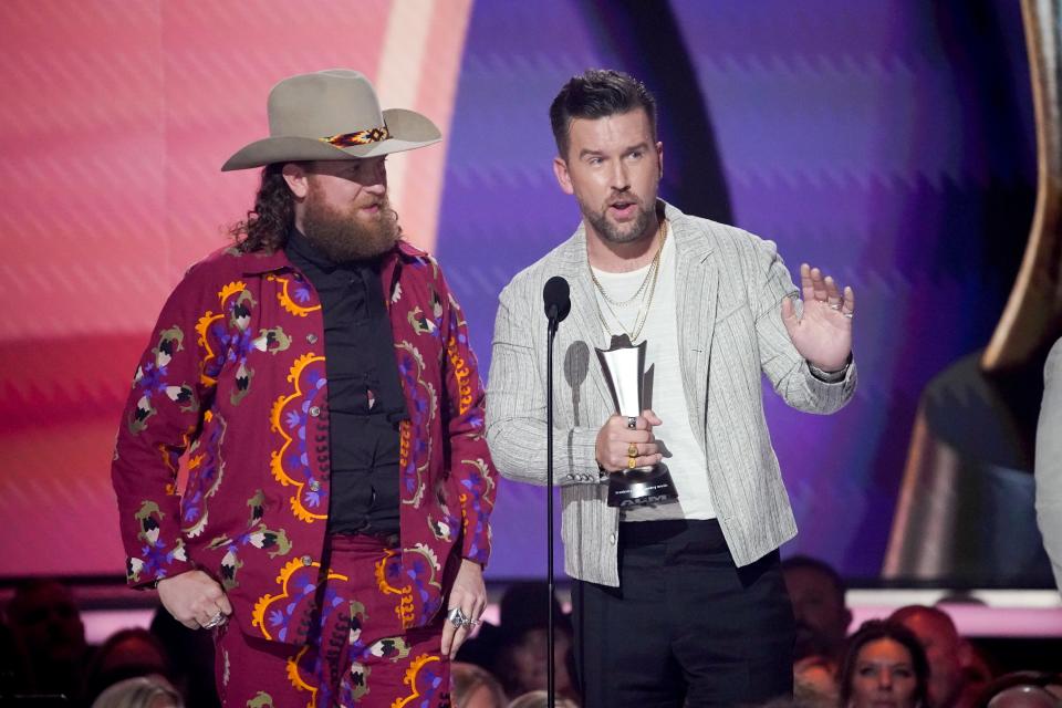 Brothers Osborne accept the award for Duo of the Year during the 58th ACM Awards at the Ford Center at the Star in Frisco Texas, on Thursday, May 11, 2023.