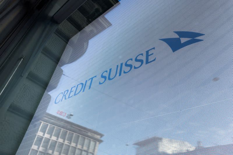 FILE PHOTO: Logos of Swiss banks UBS and Credit Suisse are seen in Zurich