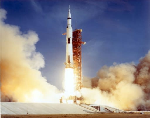 The Apollo 11 Saturn V space vehicle lifts off on July 16, 1969 with astronauts Neil Armstrong, Michael Collins, and Edwin "Buzz" Aldrin aboard