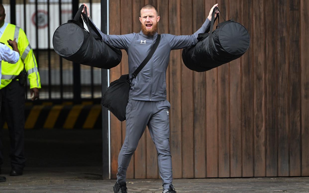 Prisoner freed as part of the early release scheme celebrates as he steps out of jail