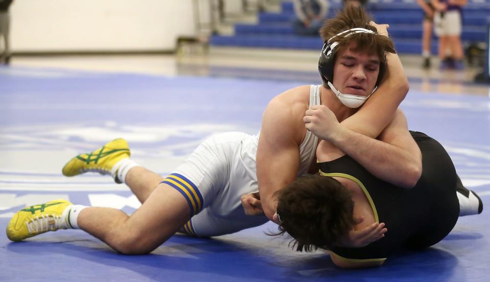 Bremerton's Thor Michaelson gets ready to pin North Kitsap's Taylor Delmendo during their dual match at Olympic High on Wednesday, Dec. 14, 2022.