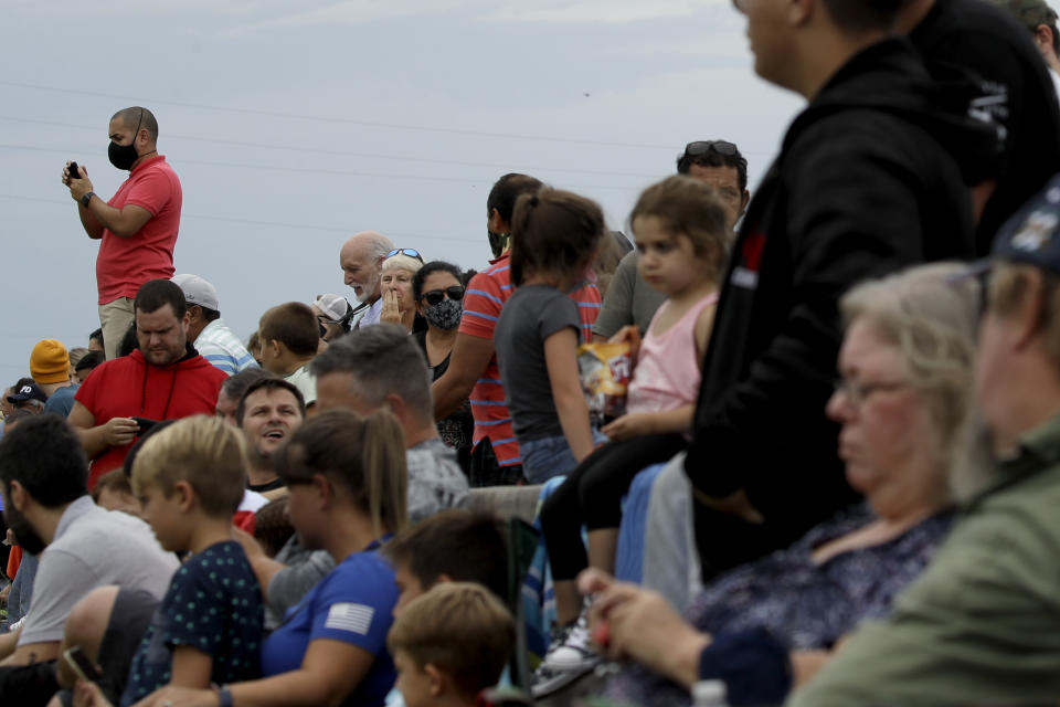 Spectators watch from Titusville, Fla. as SpaceX Falcon 9 prepares to lift off with NASA astronauts Doug Hurley and Bob Behnken in the Dragon crew capsule, Wednesday, May 27, 2020 from the Kennedy Space Center at Cape Canaveral, Fla. The launch of the SpaceX test flight to the International Space Station was scrubbed with more than 16 minutes to go in the countdown due to lightning. (AP Photo/Charlie Riedel)