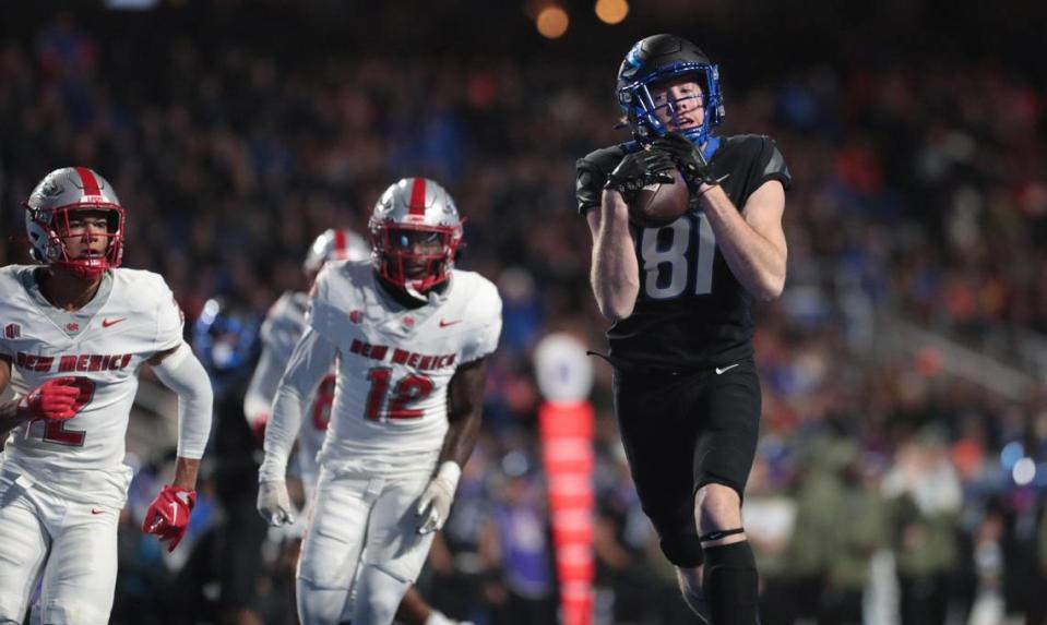 Boise State wide receiver Austin Bolt hauls in a 42-yard touchdown pass in the Broncos’ win over New Mexico last season.