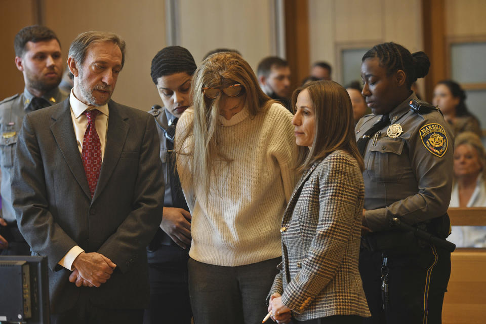 Michelle Troconis listens as a verdict of guilty on all counts is read on the final day jury deliberation for her criminal trial at Connecticut Superior Court in Stamford, Conn. Friday, March 1, 2024. Troconis was found guilty by the jury following a lengthy trial in which prosecutors laid out a case that she helped her then-boyfriend, Fotis Dolus, plot and cover up the killing of his estranged wife, Jennifer Dulos, as they battled each other in divorce and child custody proceedings. (Ned Gerard/Hearst Connecticut Media via AP, Pool)