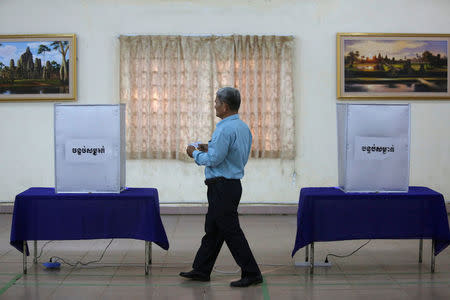 A commune counsellor approaches a ballot box to cast his ballot during a Senate election in Takhmao, Kandal province, Cambodia February 25, 2018. REUTERS/Samrang Pring