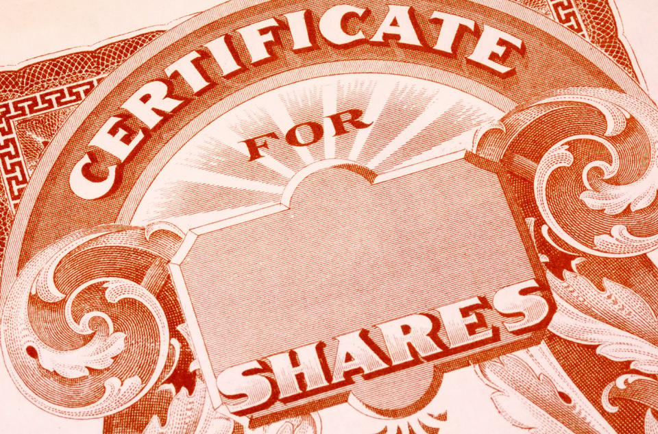 A blank paper share certificate for shares of a publicly traded company.