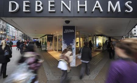 People rush past Debenhams department store on Oxford Street, in central London, January 10th 2011. REUTERS/Ki Price