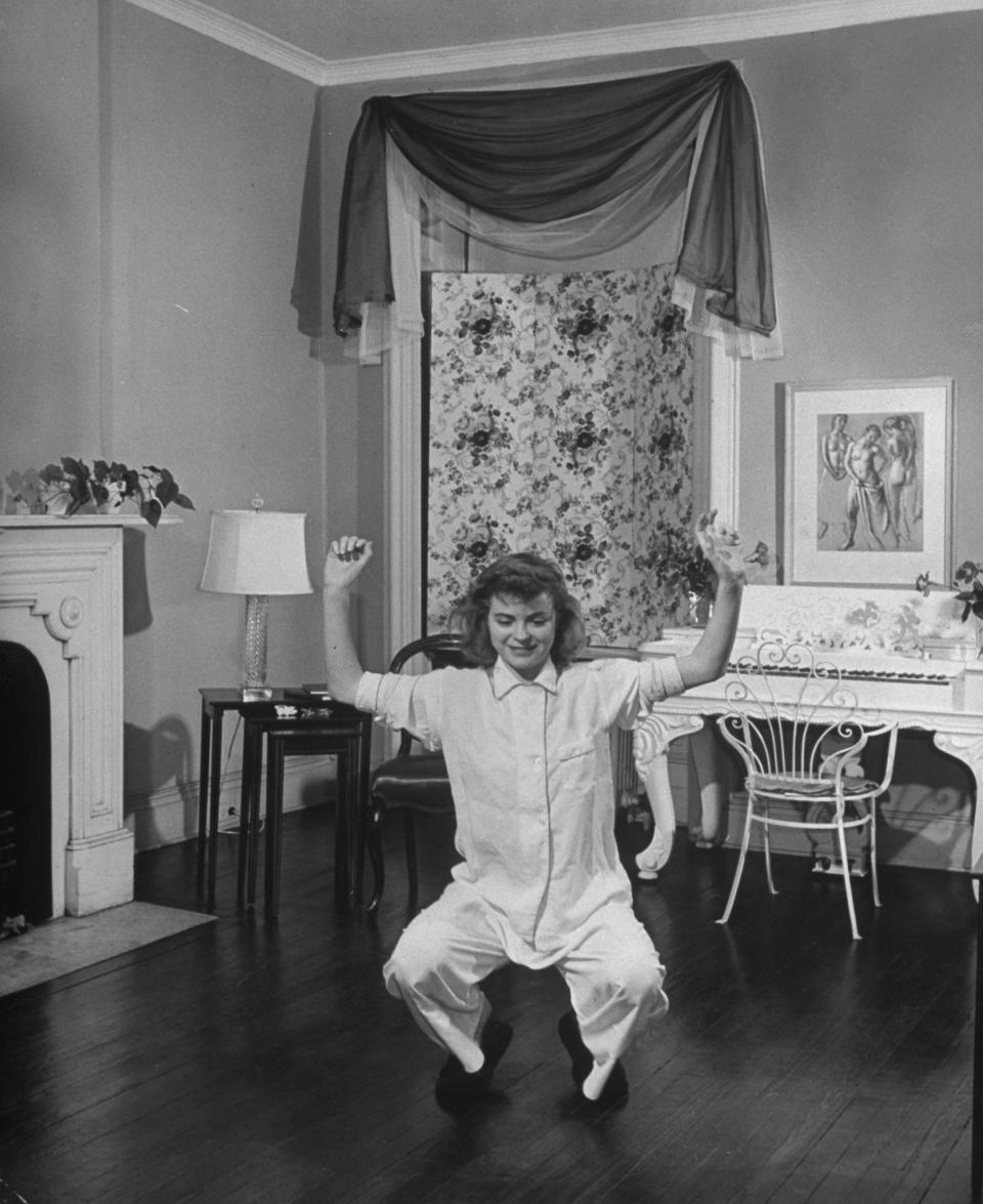 McGuire doing morning exercises wearing silk pajamas, undated.&nbsp;