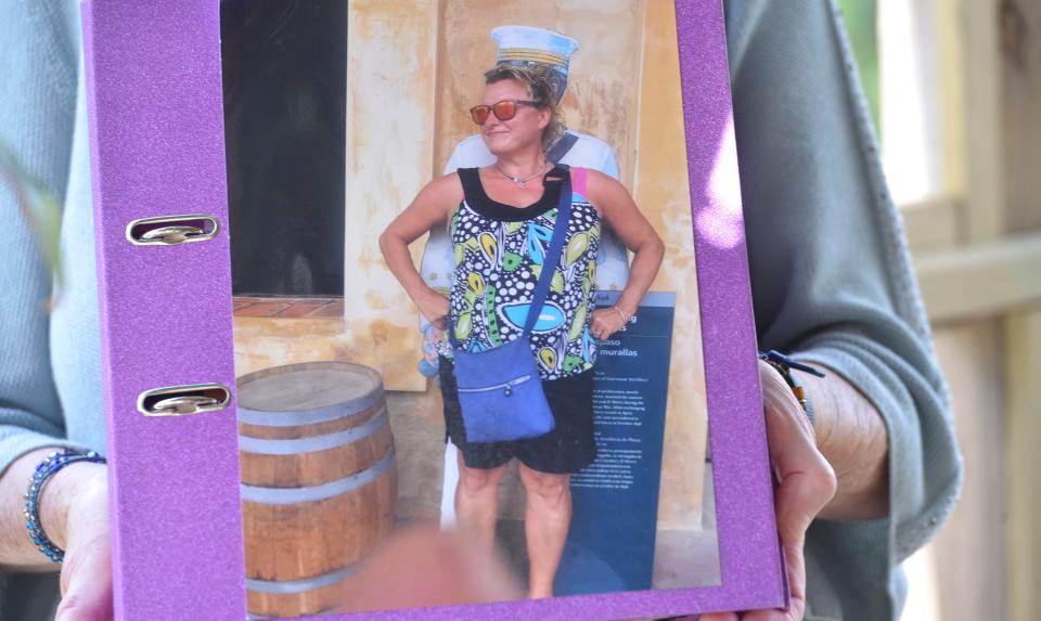 Angelika Buhndorf holds an album of photos of her daughter Rachel Schwolow who died last month. This photo was taken in February 2020 in Puerto Rico and is one of Buhndorf's favorite photos of her daughter. Friends and family are helping to raise money for the Rachel Schwolow Foundation.