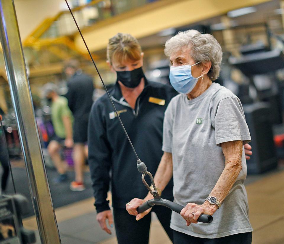 Jo Sharp, then 97, of Braintree, works out with trainer Michelle Fay at The Weymouth Club.