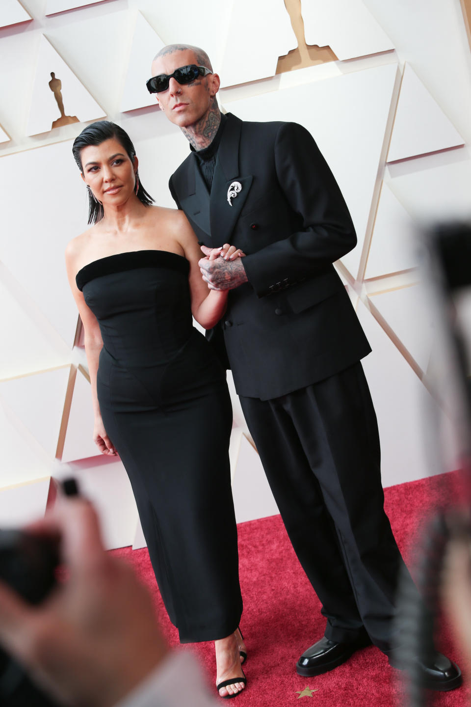 Kourtney Kardashian and Travis Barker at the 94th annual Academy Awards. - Credit: Lexie Moreland/WWD