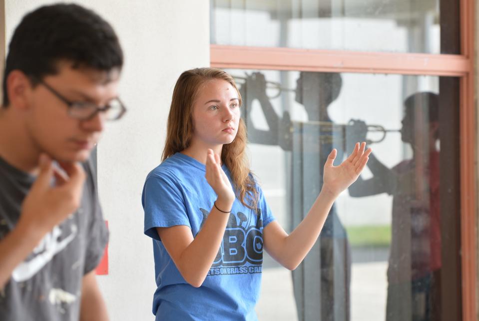 Lenny Finelli, left, is shown helping at Leesburg High School band camp in 2015. A former student told the Leesburg Police that he and Finelli had a sexual relationship after he had graduated and turned 18, but that Band Director Gabriel Fielder helped cover up sexual messages Finelli sent the student when he was 17.