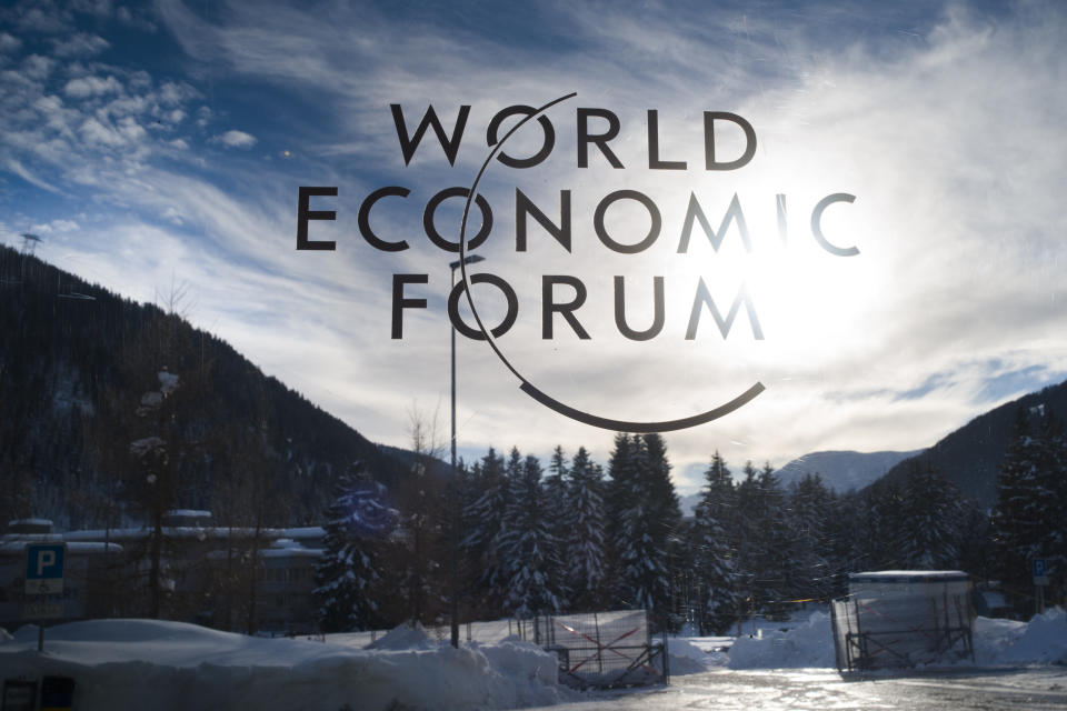 The sign of the World Economic Forum, WEF, is displayed at an entrance door at the congress center at the eve of the meeting in Davos, Sunday, Jan. 20, 2019. (AP Photo/Markus Schreiber)