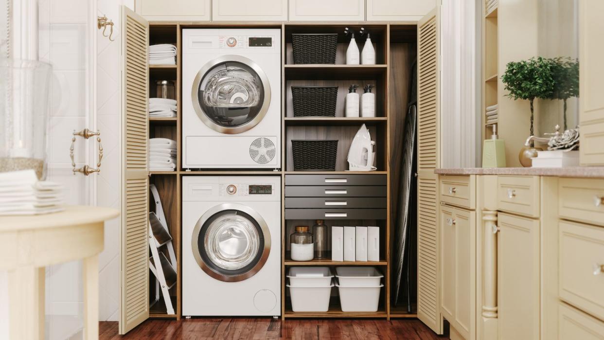  A stacked washer and dryer in a laundry closet 