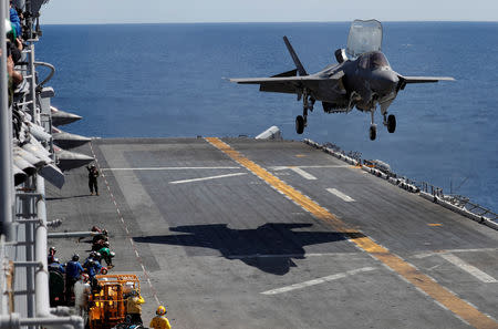 FILE PHOTO: A Marine Corps pilot prepares for a vertical landing of Lockheed Martin F-35B stealth fighter aboard the USS Wasp amphibious assault carrier during their operation in the waters off Japan's southernmost island of Okinawa March 23, 2018. REUTERS/Issei Kato/File Photo