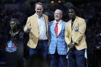 Former Indianapolis Colts players Peyton Manning and Edgerrin James stand with Indianapolis Colts owner Jim Irsay after Manning and James received their Pro Football Hall of Fame commemorative rings during an NFL football game, Sunday, Sept. 19, 2021, in Indianapolis. (AP Photo/AJ Mast)