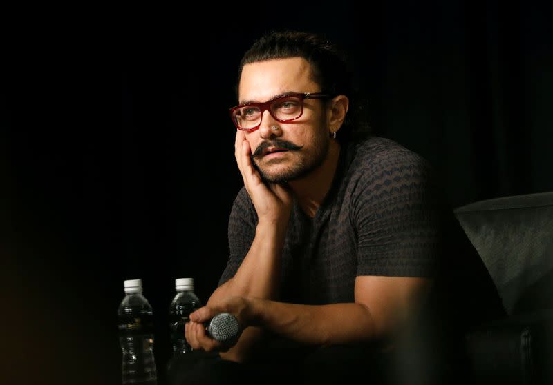 FILE PHOTO: Actor Aamir Khan speaks during a news conference in Singapore