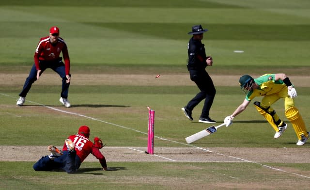 Eoin Morgan, bottom left, ran out Australia's Steve Smith with a brilliant piece of fielding but later dislocated his finger in the field