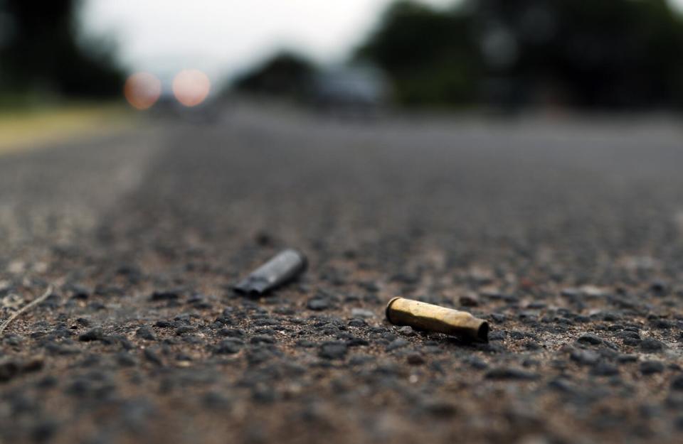 In this Oct. 16, 2019 photo spent bullet casings litter the site where a convoy of Michoacan