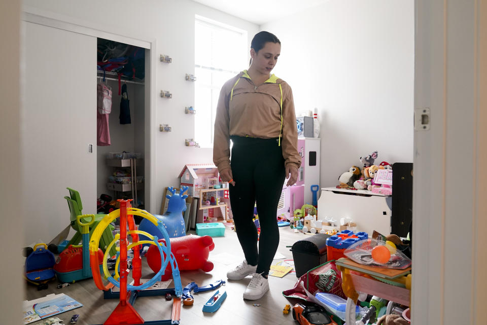 Jefferson Union High School District administrative assistant Taylor Garcia walks through her children's playroom in Daly City, Calif., Friday, July 8, 2022. The school district in San Mateo County is among just a handful of places in the country with educator housing. But with a national teacher shortage and rapidly rising rents, the working class district could serve as a harbinger as schools across the U.S. seek to attract and retain educators. (AP Photo/Godofredo A. Vásquez)