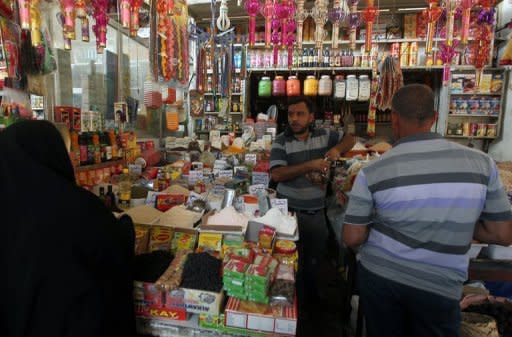 People shop for food in Baghdad on July 29, ahead of the upcoming Muslim holy month of Ramadan. Iraq is a less safe place than it was one year ago as security continues to deteriorate, an American watchdog warned on Saturday, just months ahead of a US withdrawal from the country