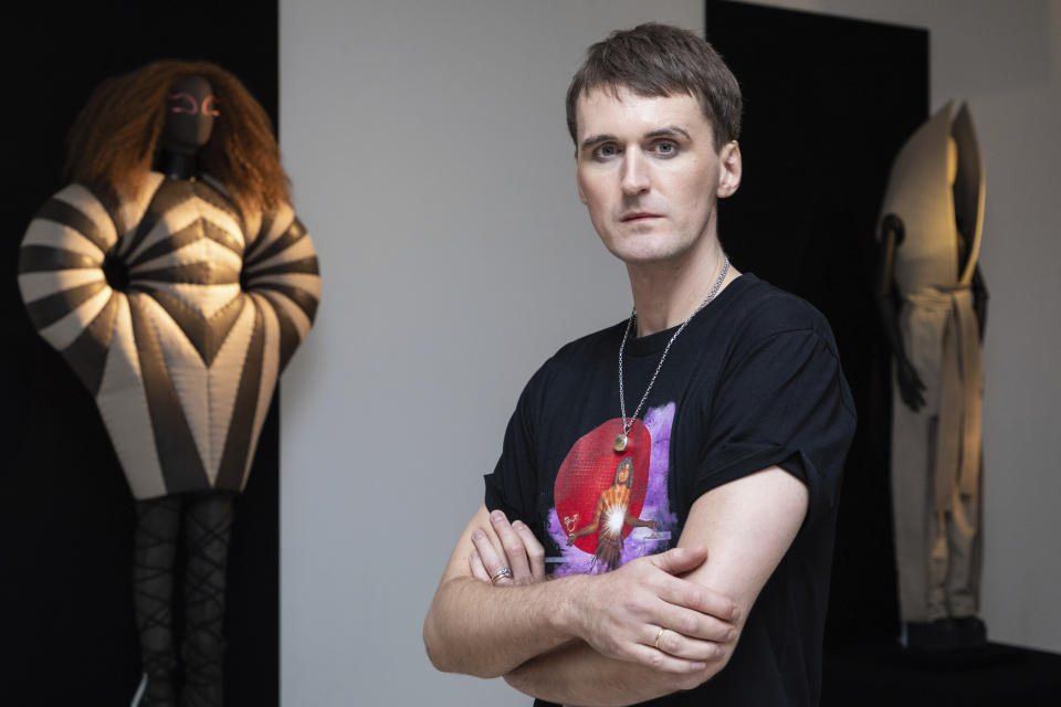 Fashion designer Gareth Pugh poses for a photograph in front of his creations, exhibited ahead of his London Fashion Week show in London, Wednesday, Sept. 16, 2020. (Photo by Vianney Le Caer/Invision/AP)