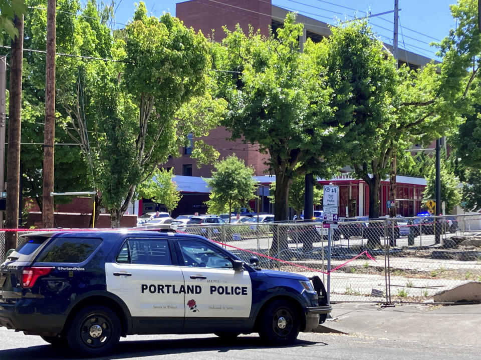 Portland Police respond to a shooting at the Legacy Good Samaritan Medical Center in Portland, Ore., Saturday, July 22, 2023. Gunfire erupted in a maternity unit of the Oregon hospital over the weekend, fatally wounding an unarmed security guard and leading to renewed calls Monday, July 24, to protect health care workers from increasing violence. (Maxine Bernstein/The Oregonian via AP)