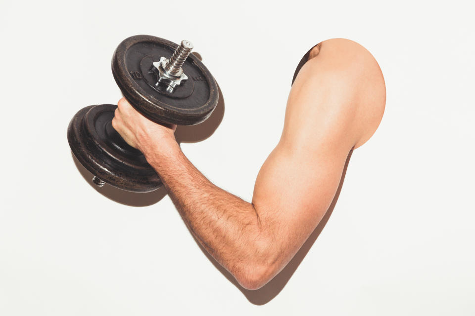 Pictured: Male arm lifts weights. Image: Getty