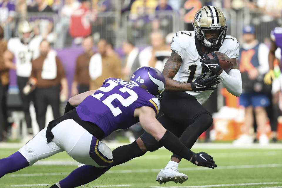 New Orleans Saints wide receiver A.T. Perry (17) runs against Minnesota Vikings safety Harrison Smith (22) during the first half of an NFL football game Sunday, Nov. 12, 2023, in Minneapolis. (AP Photo/Matt Krohn)