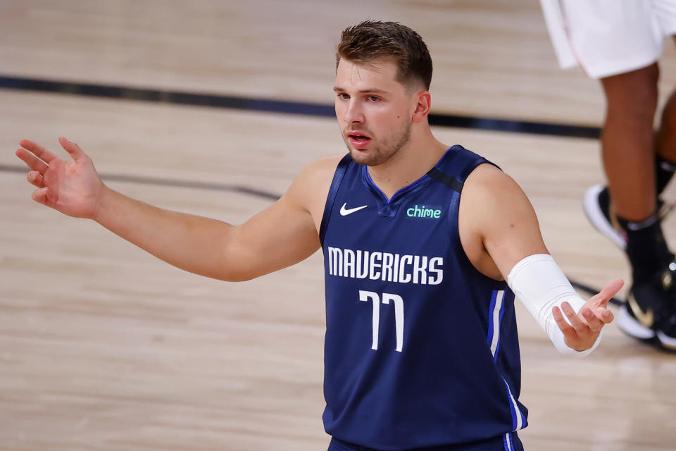 Luka Doncic #77 of the Dallas Mavericks reacts against the LA Clippers in Game Four of the Western Conference First Round during the 2020 NBA Playoffs at AdventHealth Arena at ESPN Wide World Of Sports Complex on August 23, 2020 in Lake Buena Vista, Florida. NOTE TO USER: User expressly acknowledges and agrees that, by downloading and or using this photograph, User is consenting to the terms and conditions of the Getty Images License Agreement.  (Photo by Kevin C. Cox/Getty Images)