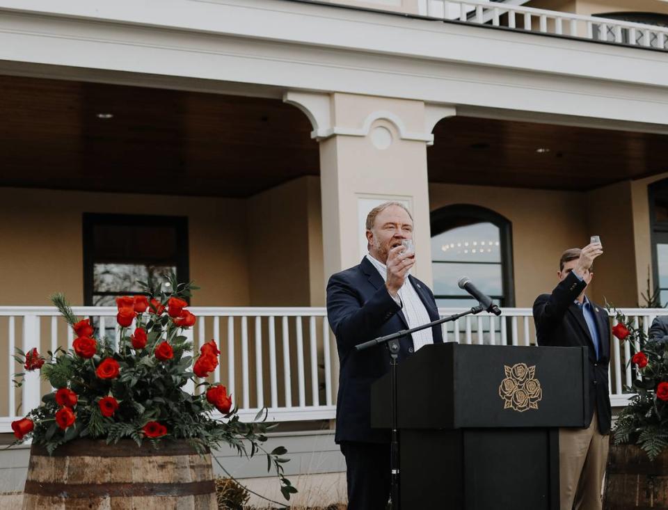 Four Roses master distiller Brent Elliott, with Gov. Andy Beshear, toasted the opening of the new visitors center at the Lawrenceburg distillery on Tuesday.