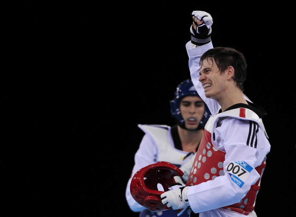 Walkden's long-time boyfriend, Aaron Cook, is also one of the sport’s most famous fighters (Picture: Reuters)